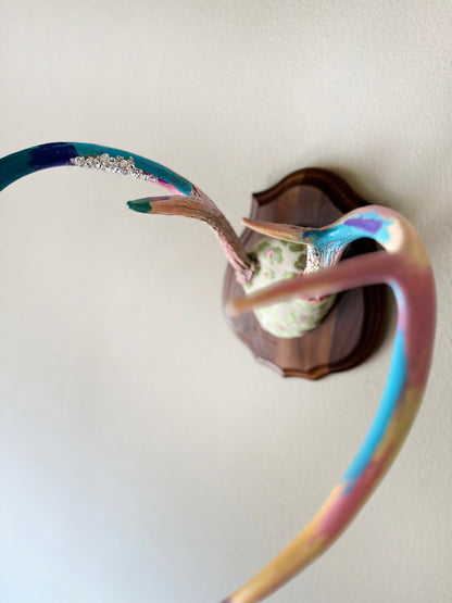 image of large real white tail deer antlers colorfully hand painted, mounted and covered in pastel neon green and pink cheetah leopard print fabric